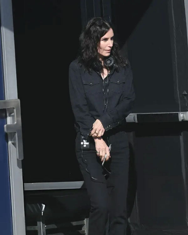 Courteney Cox Evil Genius Black Shirt